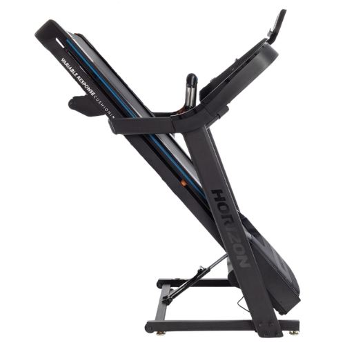Horizon folding treadmill shown in upright storage position