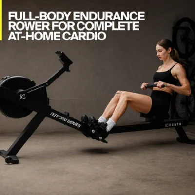 Woman using CENTR Perform Series rowing machine at home