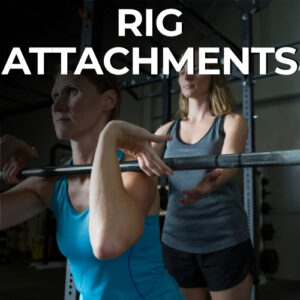 Two women training with barbell on gym rig attachments