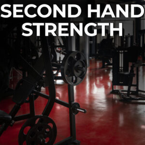 Second hand gym equipment in a dark fitness centre