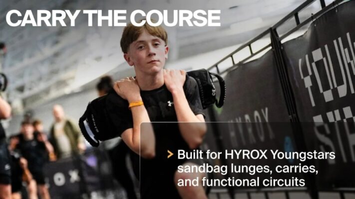 centr x hyrox youngstars | 7.5kg competition sandbag Young athlete carrying sandbag at HYROX Youngstars competition