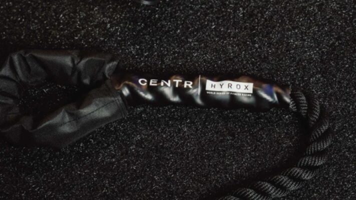 Centr and Hyrox branded battle rope handle on dark surface